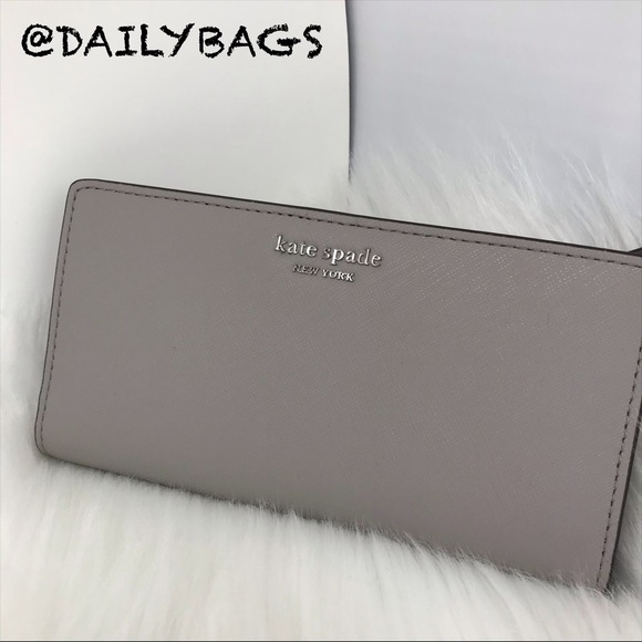 kate spade Handbags - KATE SPADE LARGE SLIM BIFOLD WALLET TAUPE GRAY